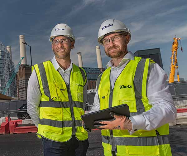 Two members of staff on a construction site in London