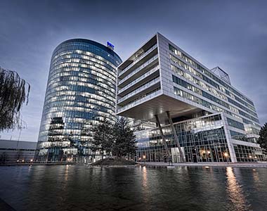 Modern building with water in foreground