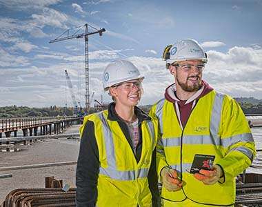 Two workers on the Mersey Bridge during construction