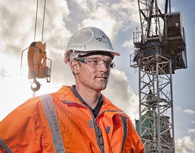 Worker infront of a crane