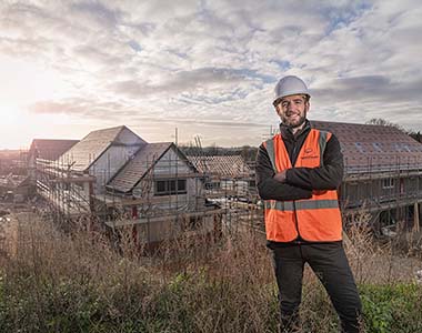 Company boss in Hi-viz on a small house building site